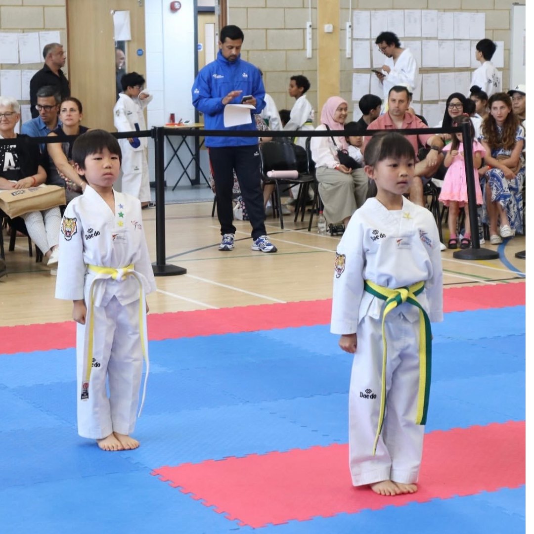 Little Panthers students lined up in dobok at a grading